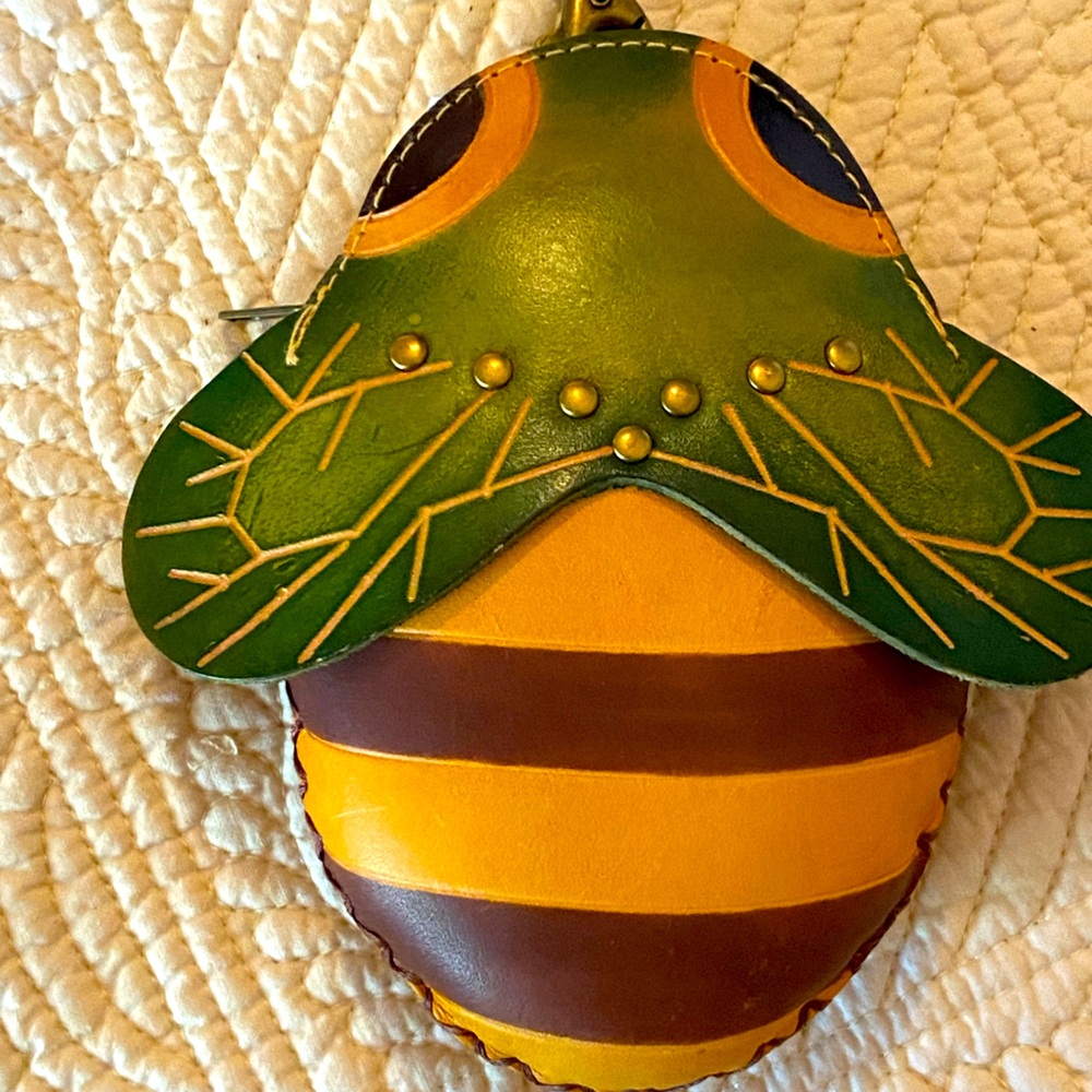 Leather bee wristlet.